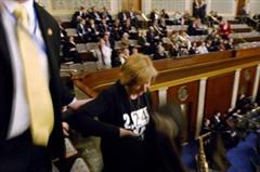 Cindy Sheehan, anti-war protestor is escorted out of the State of the Union Address & Arrested